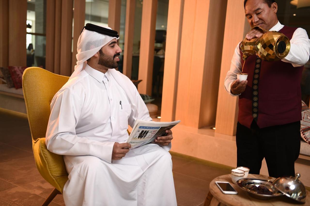 海岸线海滩穆尔瓦度假村 乌姆赛义德 外观 照片 A Qatari man wearing the dishda'a