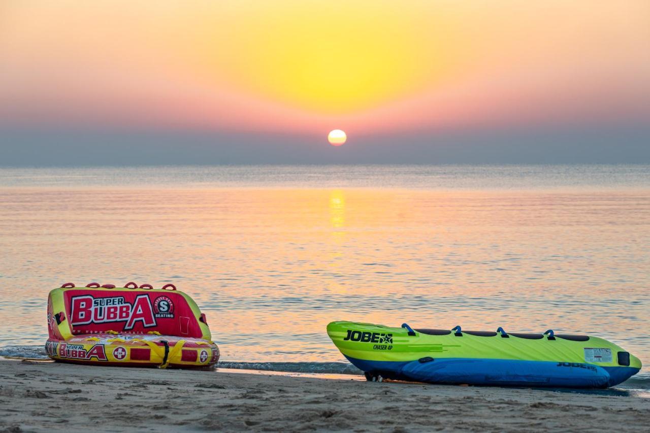 海岸线海滩穆尔瓦度假村 乌姆赛义德 外观 照片 Sunset at the beach