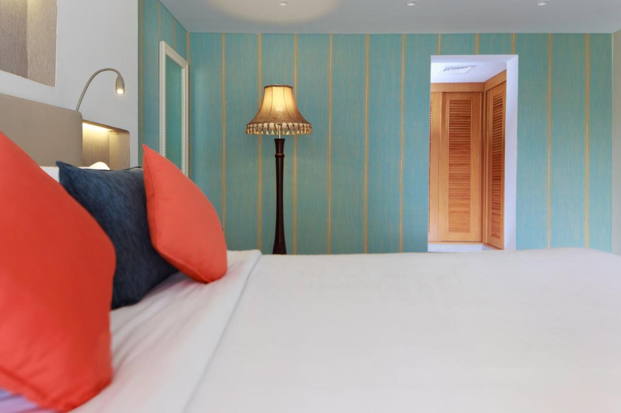 海岸线海滩穆尔瓦度假村 乌姆赛义德 外观 照片 A bedroom at the hotel