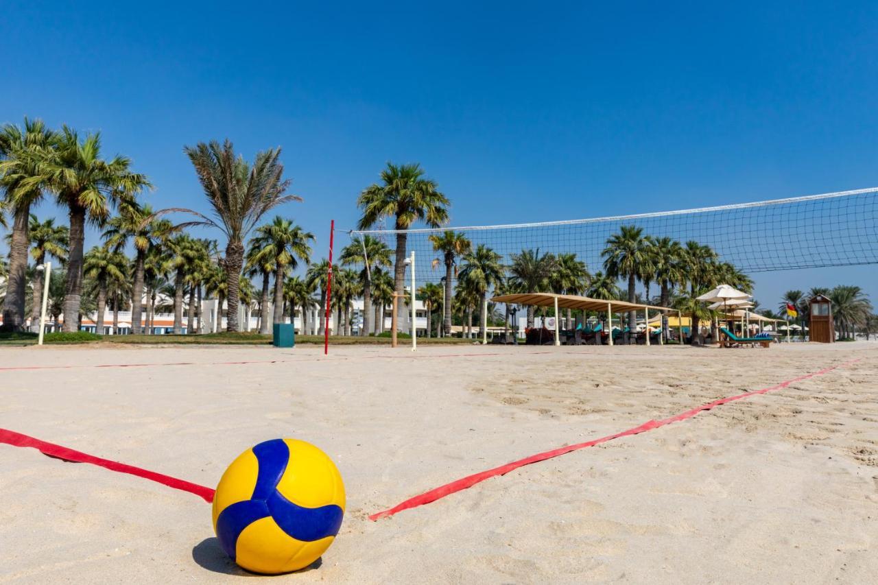 海岸线海滩穆尔瓦度假村 乌姆赛义德 外观 照片 A beach volleyball court